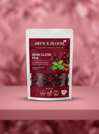 Brew & Bloom Skin Glow Tea package on a pink background